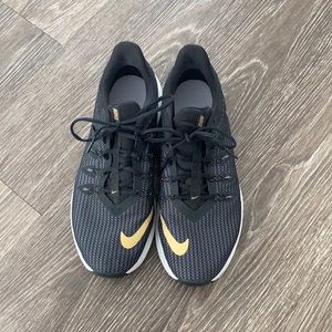 Black and gold Nike sneakers
